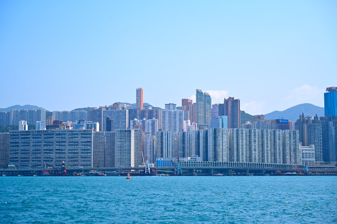 a large body of water with a city in the background