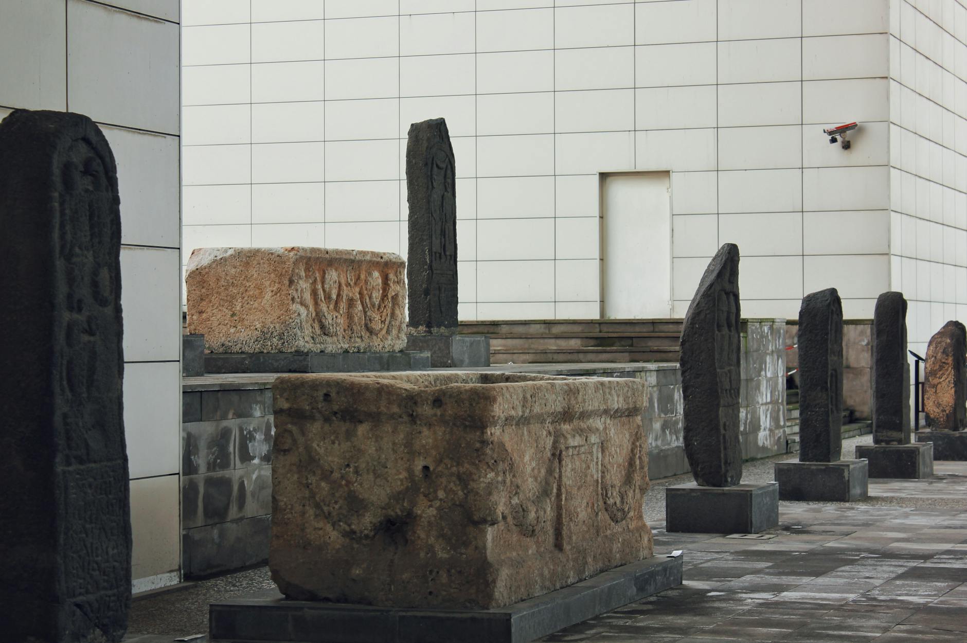 Historic stone artifacts displayed outdoors in Gaziantep, Turkey, showcasing ancient cultural heritage.