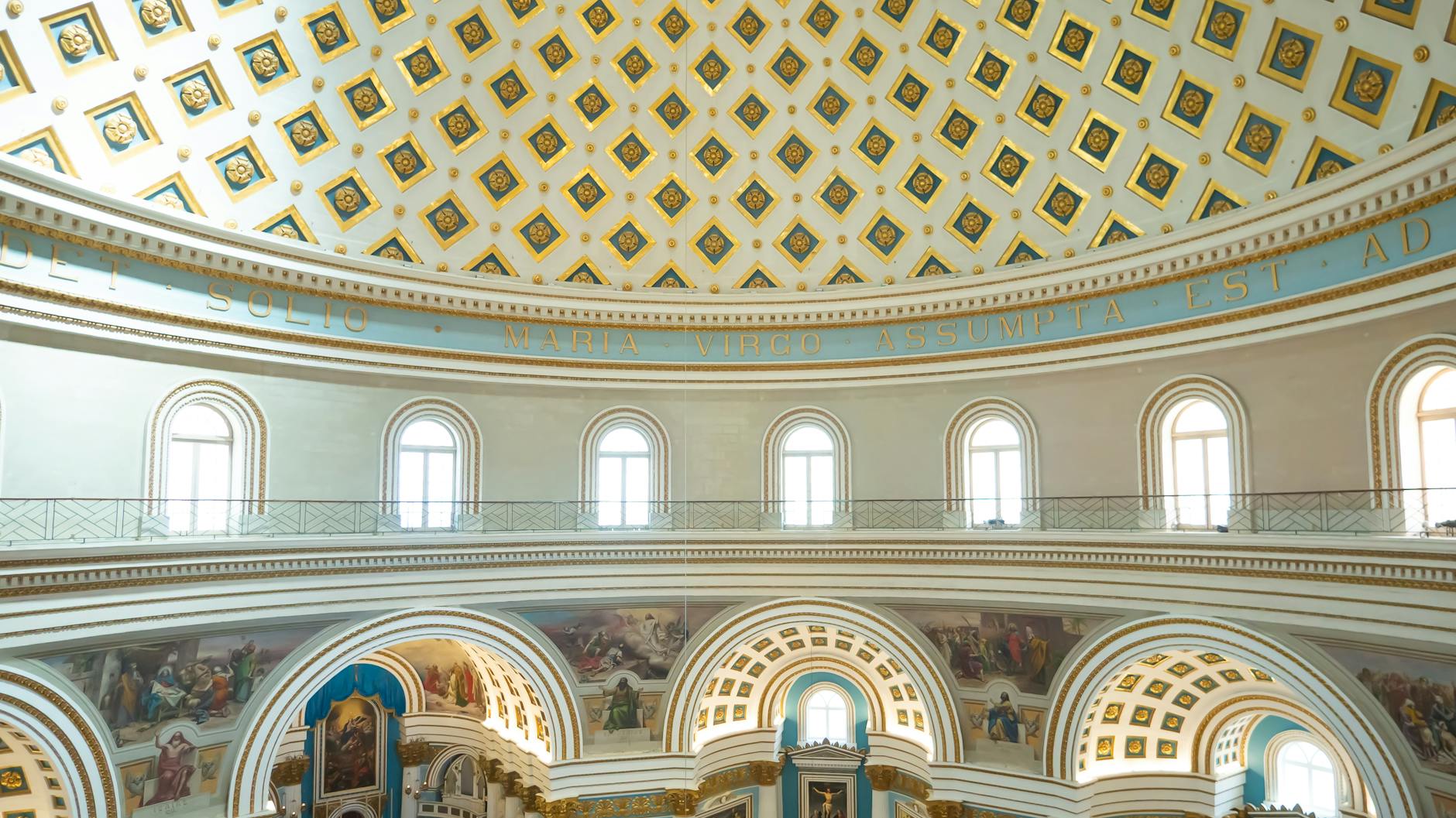 Intricate interior design of the Mosta Rotunda, featuring its iconic dome and detailed architecture.