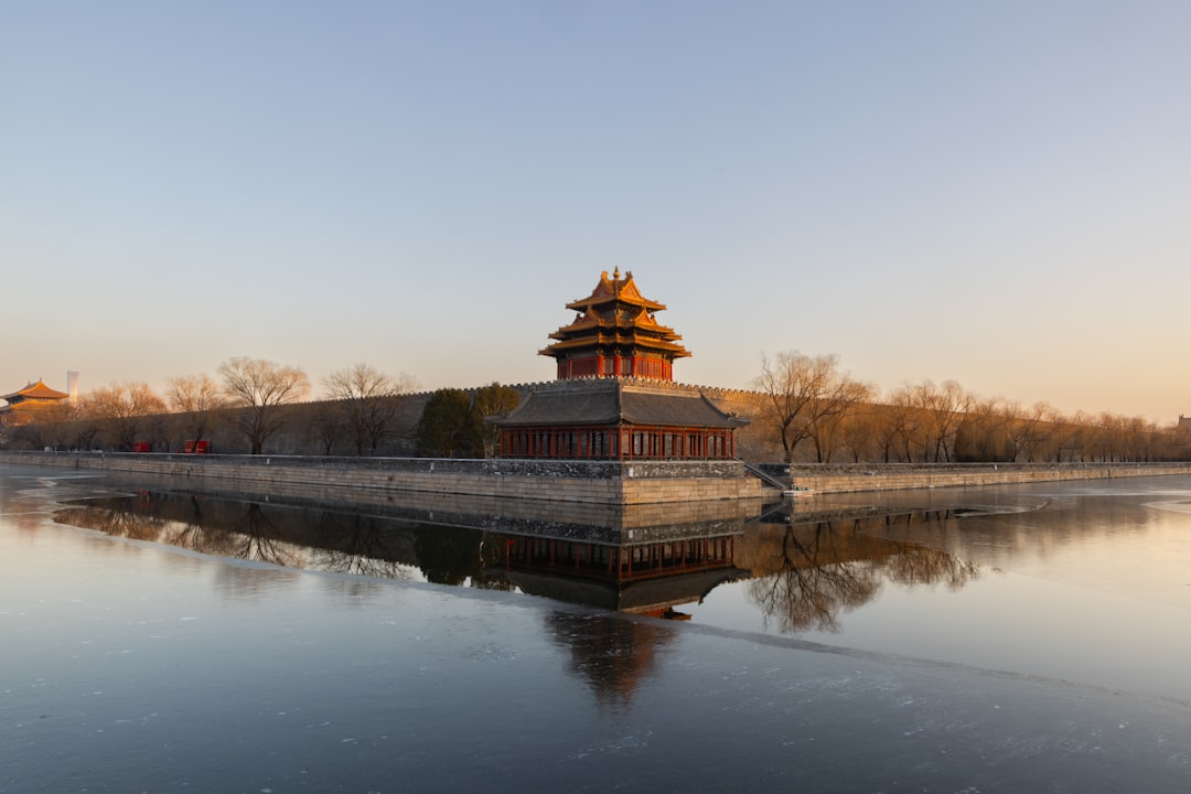 A large body of water with a building in the background