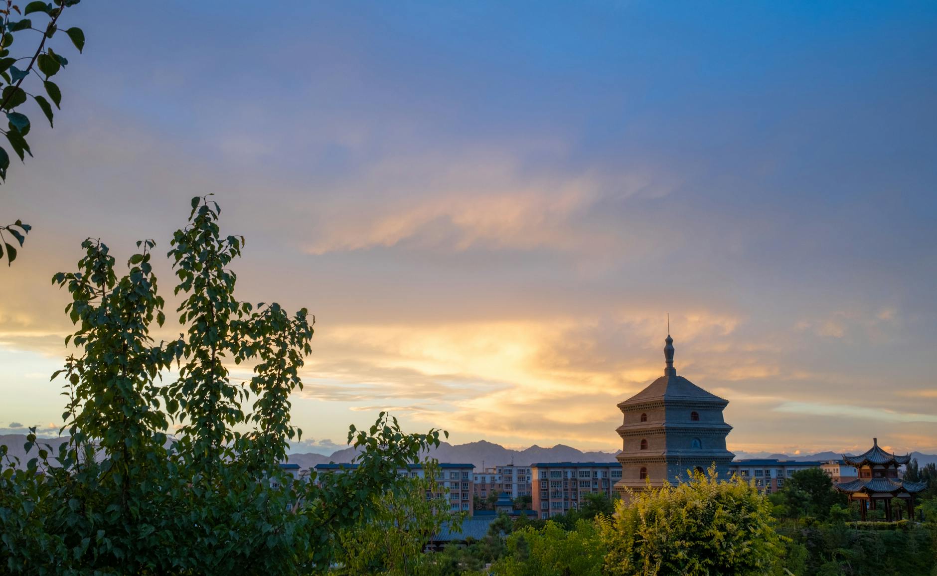 A stunning sunset over the Giant Wild Goose Pagoda, showcasing the ancient architectural beauty in Xi'an, China.