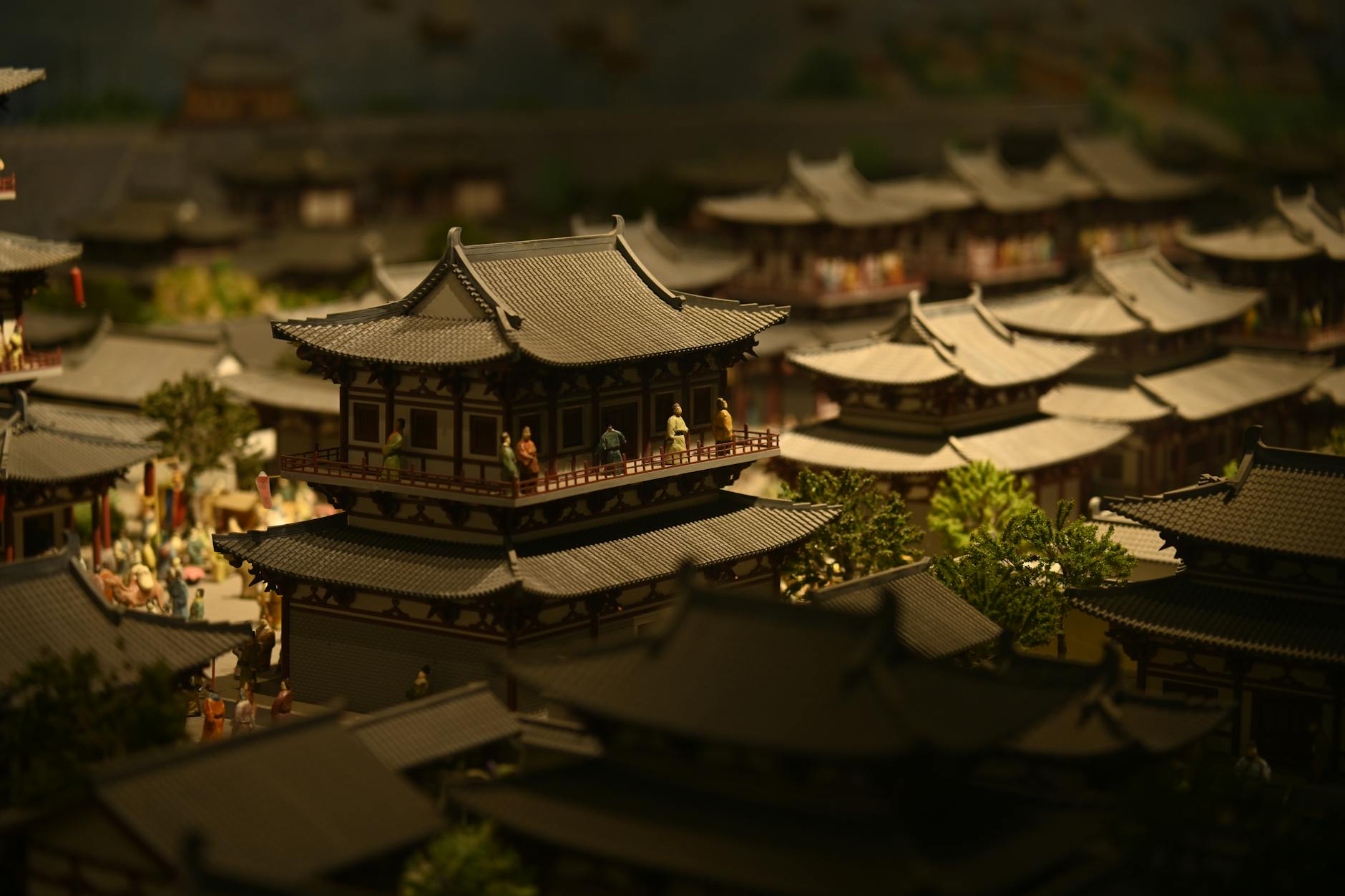Detailed miniature scene depicting traditional Asian architectural style with figurines.