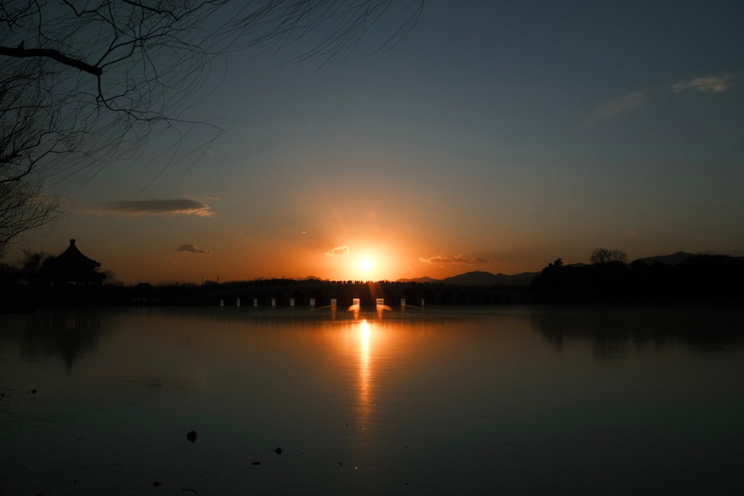 Sunset over a bridge and calm water