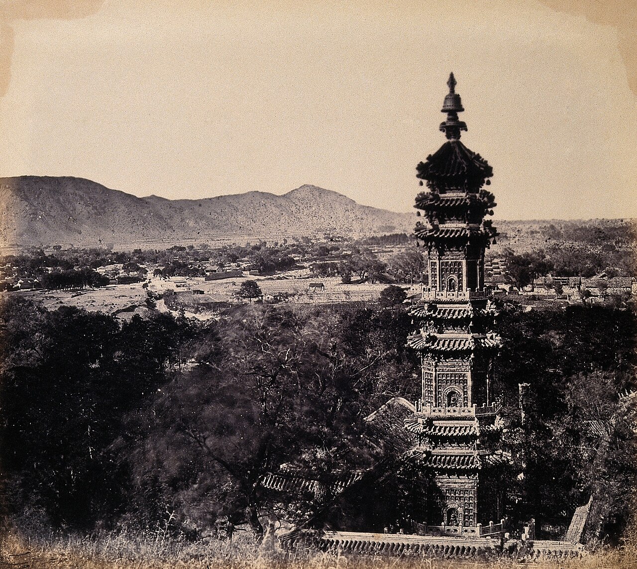 View of the Pagoda at The Imperial Summer Palace (Yuan Ming Yuan), Beijing, China, prior to its destruction by the English and French armies. October 1860
Ico