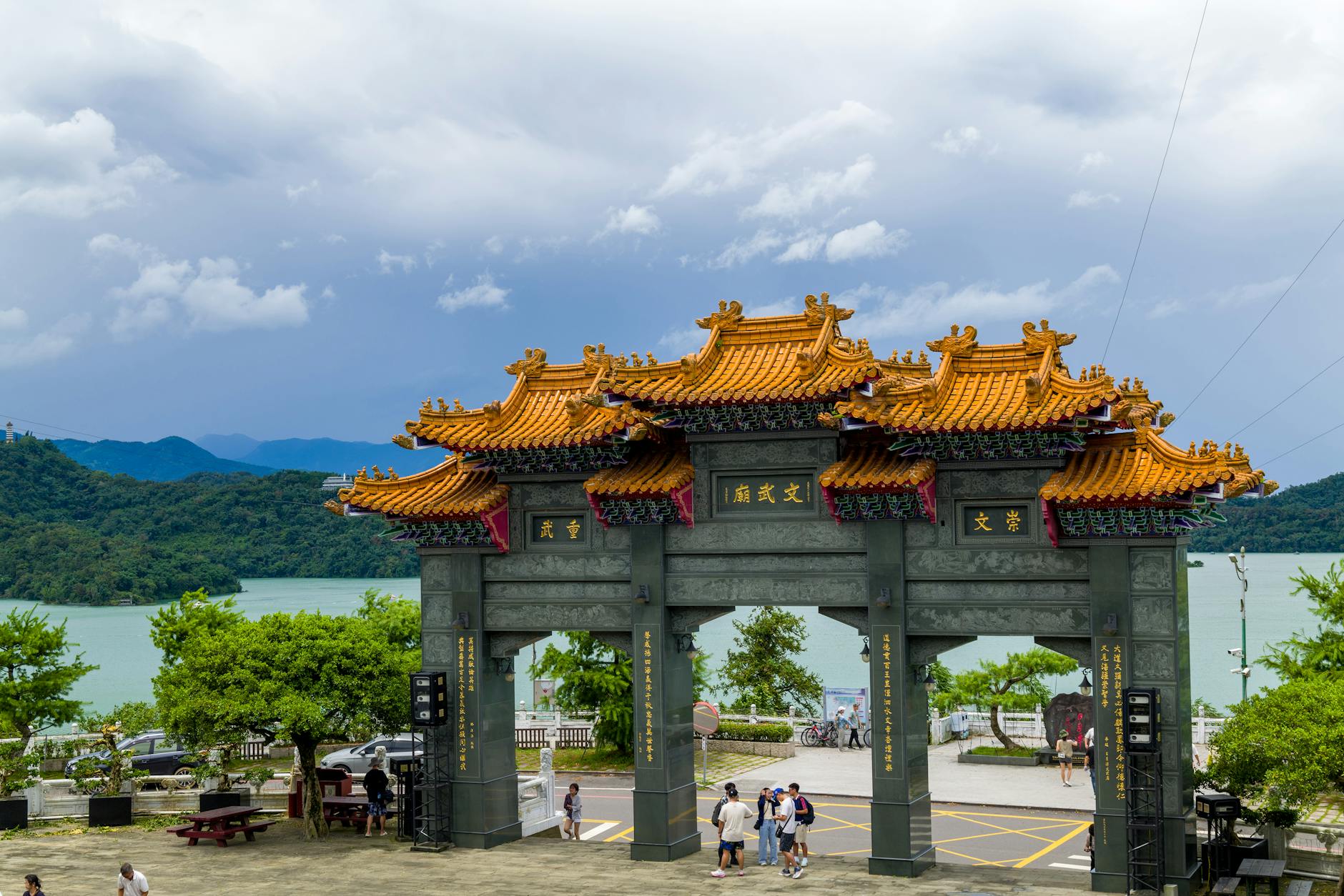 Scenic view of traditional archway at Sun Moon Lake in Taiwan surrounded by lush greenery and lakeside.