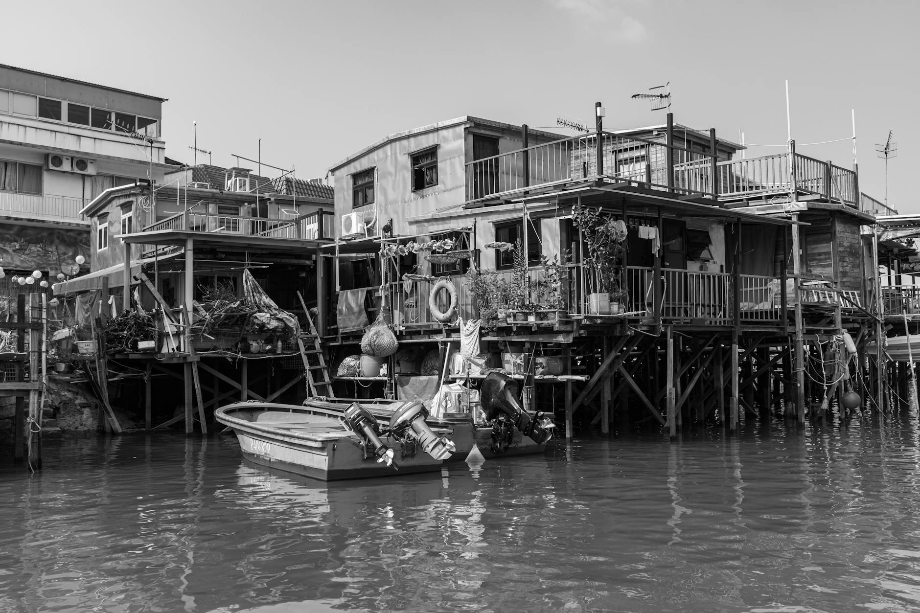 Black and white photo of Tai O's iconic stilt houses reflecting cultural heritage.