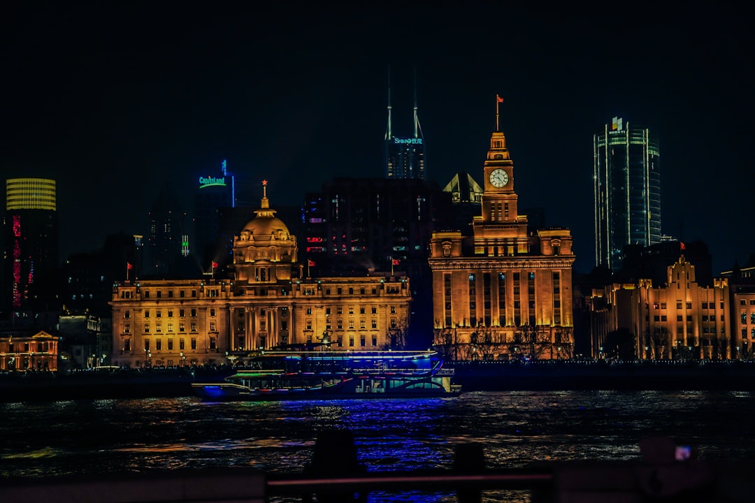 Night view of a city with illuminated buildings.