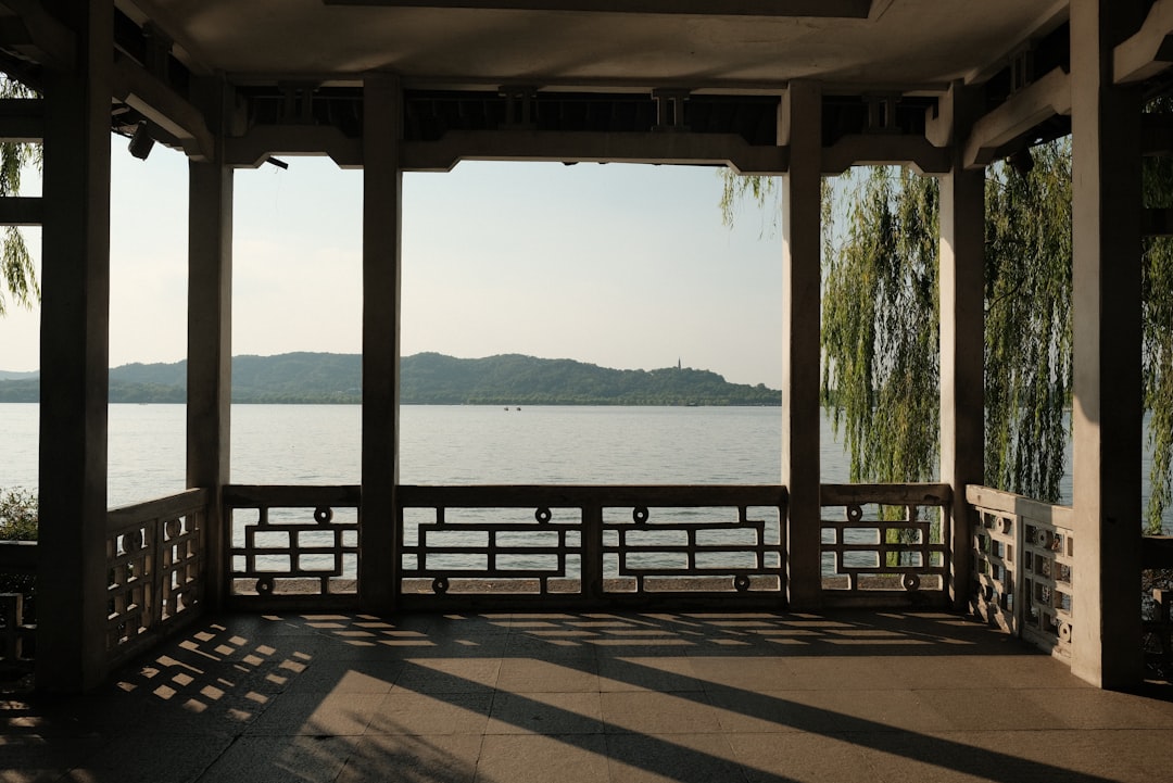 A gazebo with a view of a lake and mountains