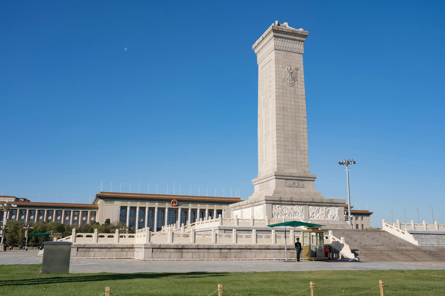 Monument to the People's Heroes in Tiananmen Square, Beijing, China, under a clear blue sky.