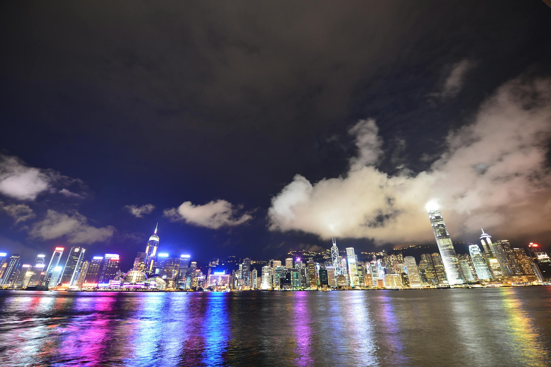 Stunning nighttime view of Hong Kong's illuminated skyline reflecting on Victoria Harbour.