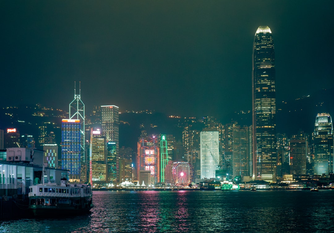 Nighttime skyline of hong kong lit up.