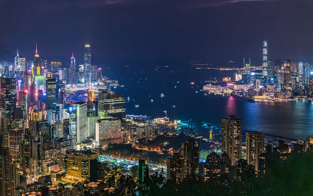 Vibrant cityscape with harbor at night