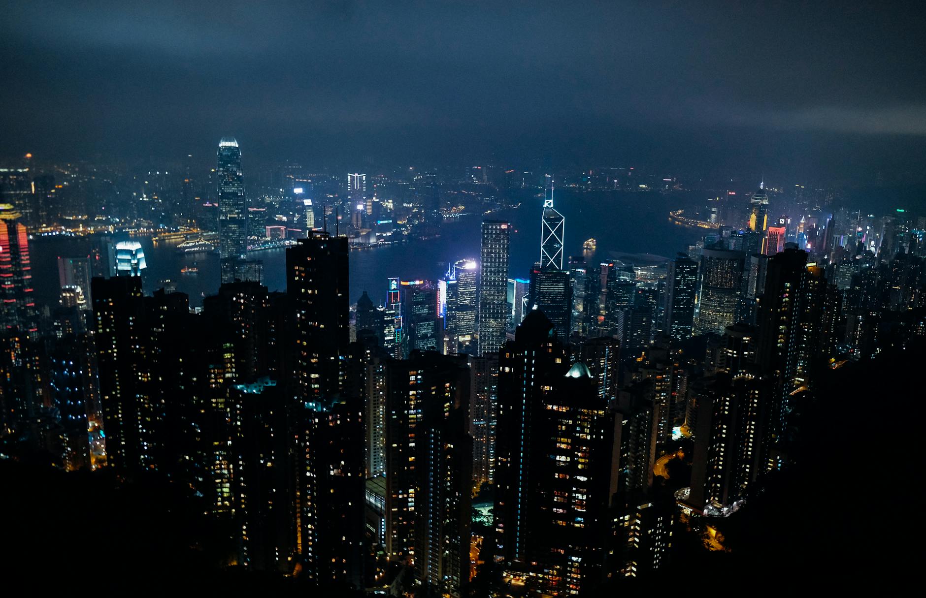Stunning nighttime view of Hong Kong's vibrant skyline with illuminated skyscrapers.