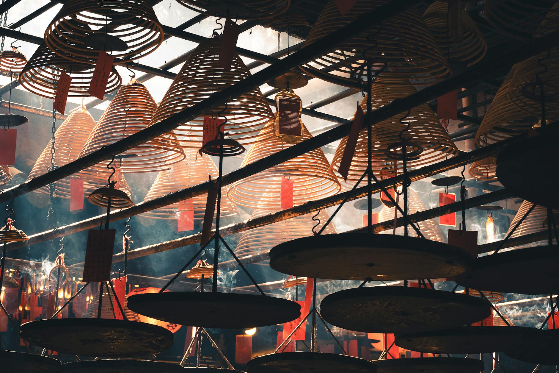 Spiral incense coils hang in a Hong Kong temple creating a mesmerizing visual display.