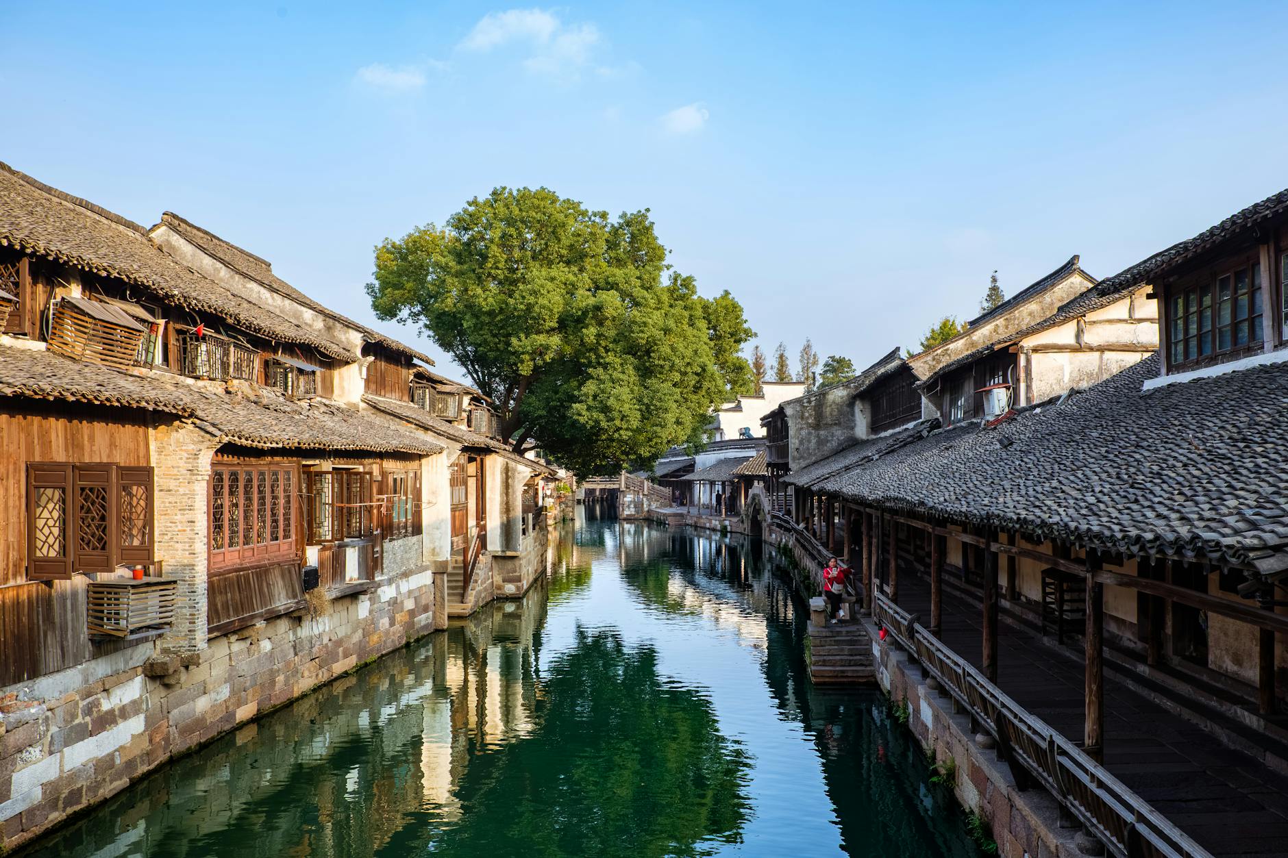 Picturesque view of a traditional canal in Wuzhen Ancient Town, offering a glimpse into historic Chinese architecture.