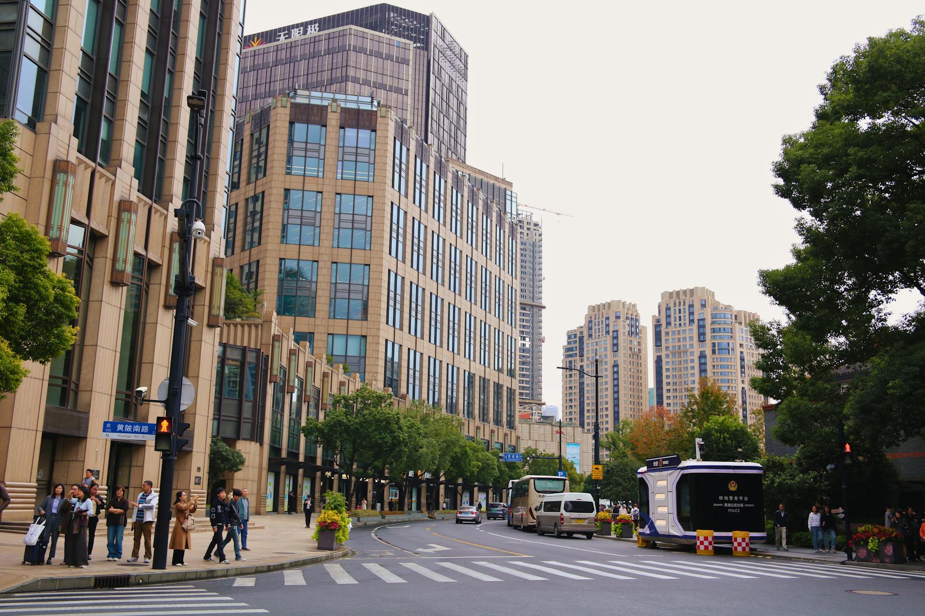 View of modern buildings and streets in Shanghai, China, showcasing urban architecture.