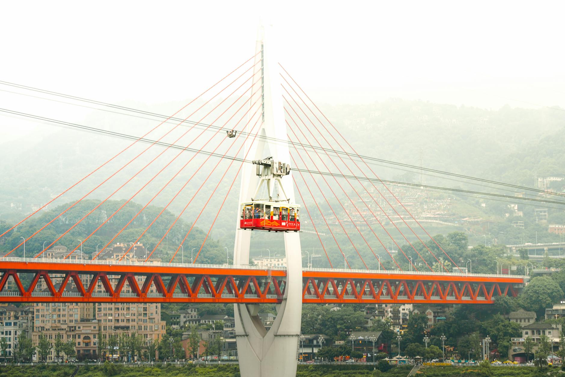A futuristic cable car crossing the iconic bridge in Chongqing, China.