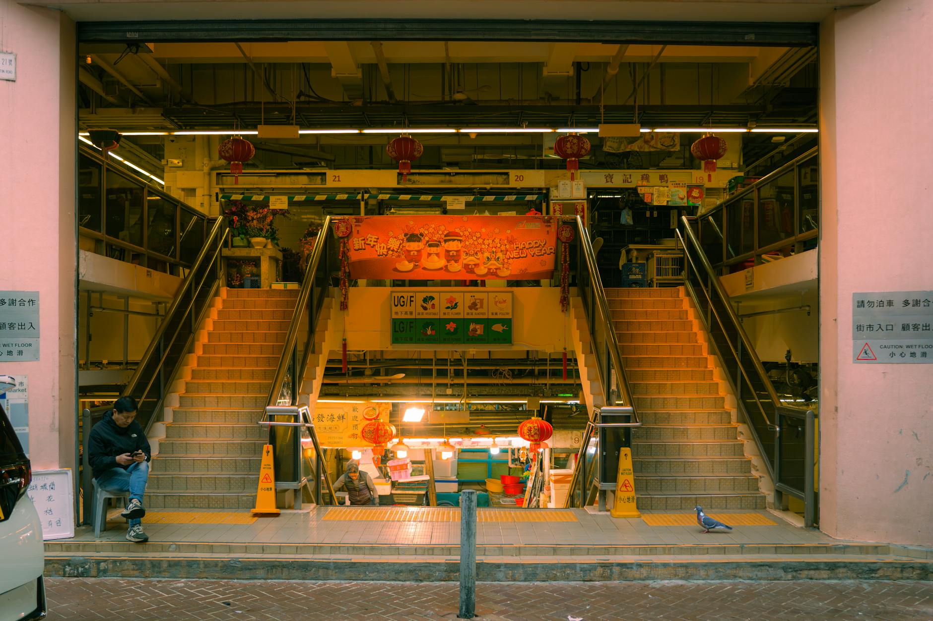 Explore a bustling Hong Kong market with vibrant decorations and traditional architecture.