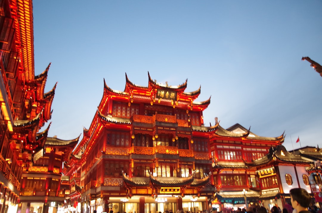 Traditional red buildings illuminated at dusk