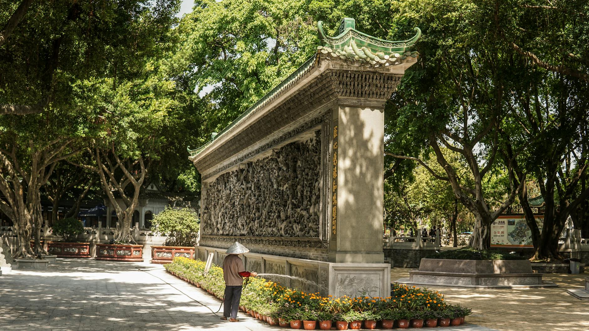Explore the historical beauty of Baomo Garden with intricate Chinese wall architecture in Guangzhou.