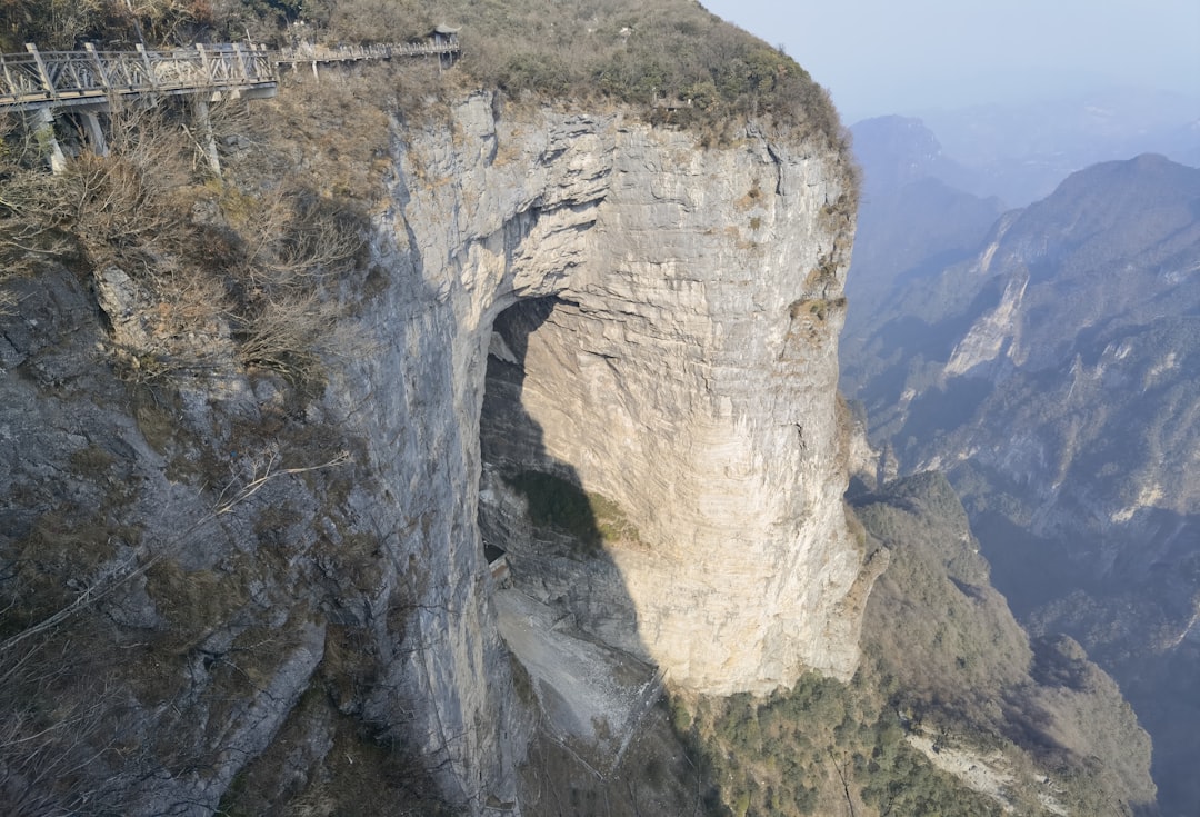 A man standing on the edge of a cliff